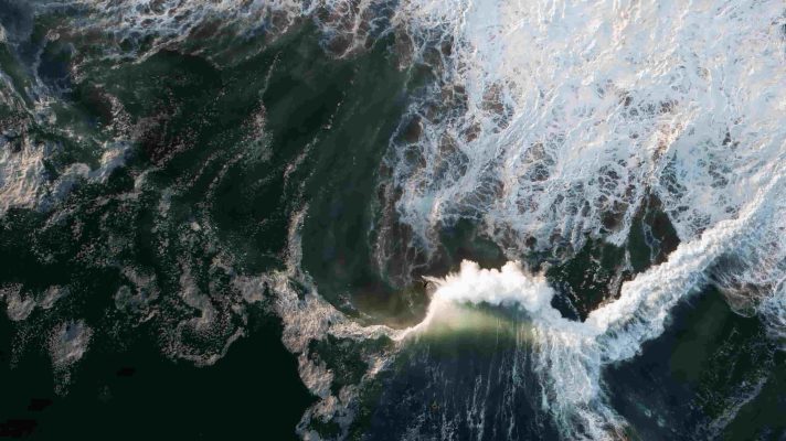 Crashing waves (credited by AdobeStock)